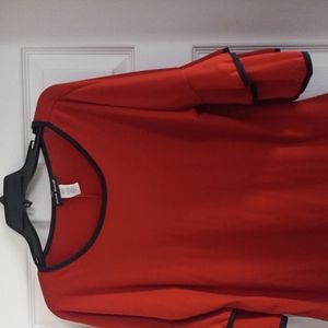 Women burnt orange red top